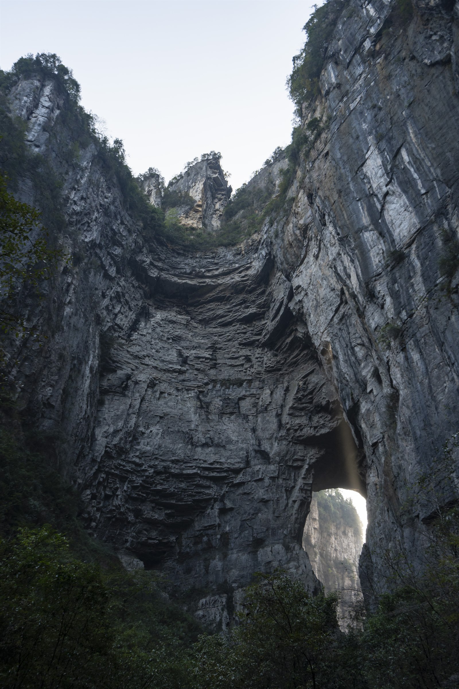 The monumental limestone cliffs and natural bridge landscape at Wulong